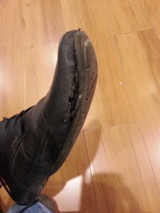A worn through shoe belonging to one of the cofounders in the early days