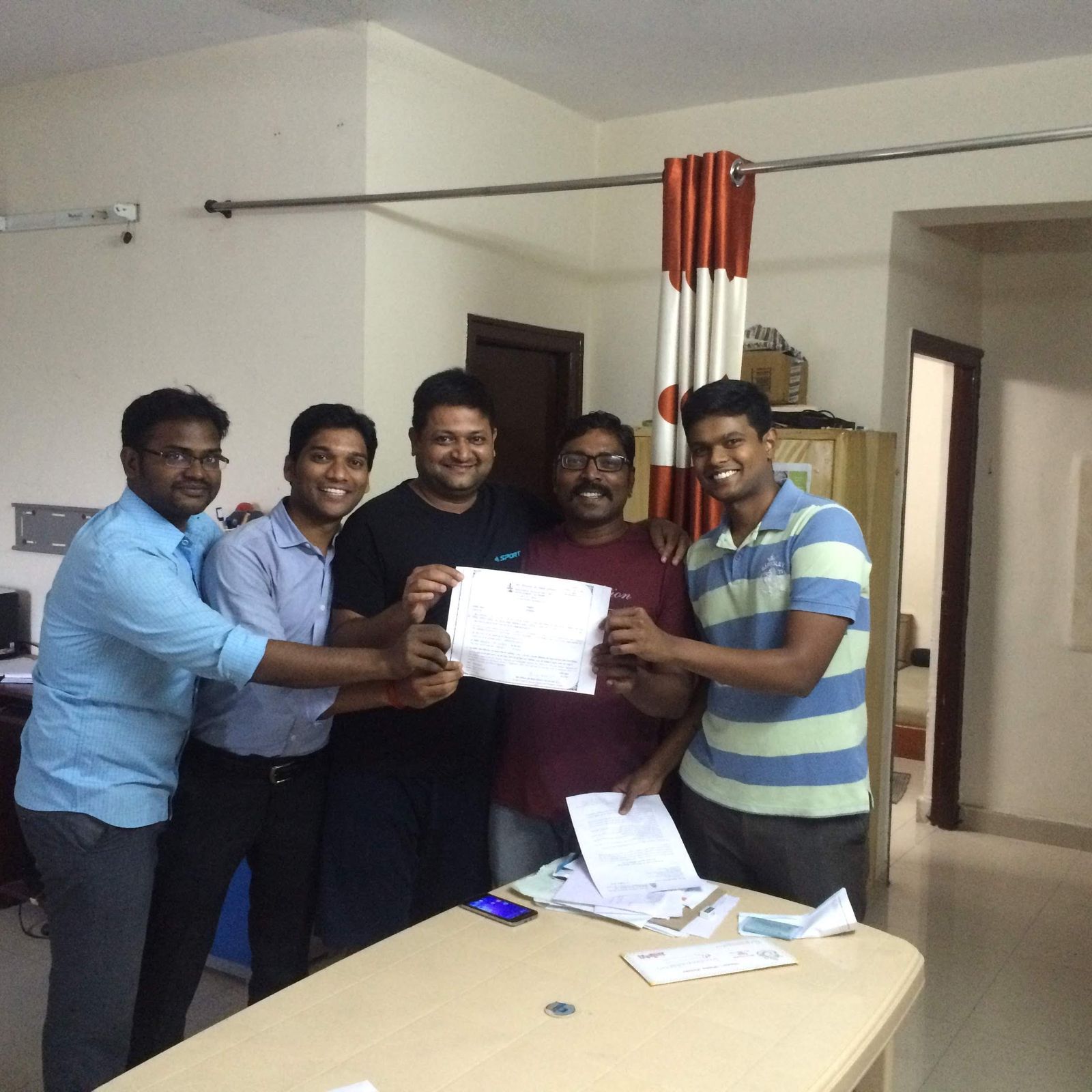 The team holding up the IRDAI direct broker licence, Certificate No. 574