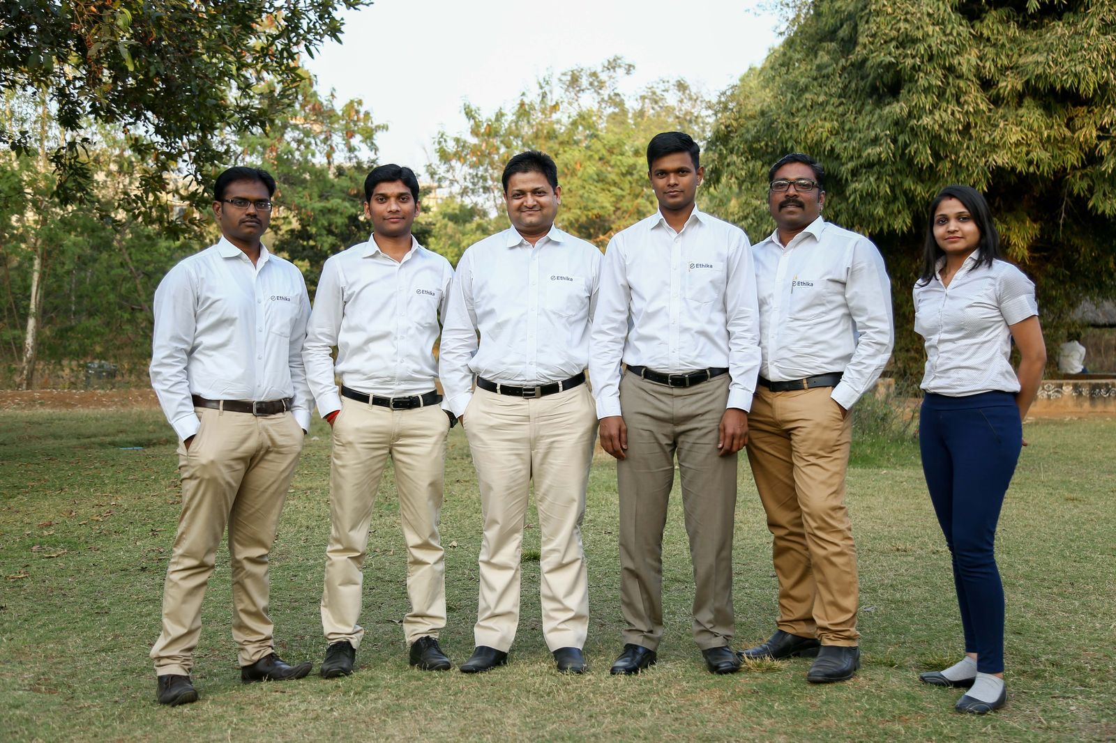 The early Ethika team together in company whites