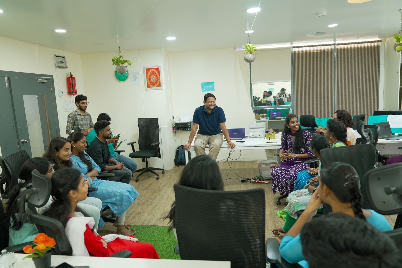Susheel in an open circle session with the team at the Ethika office