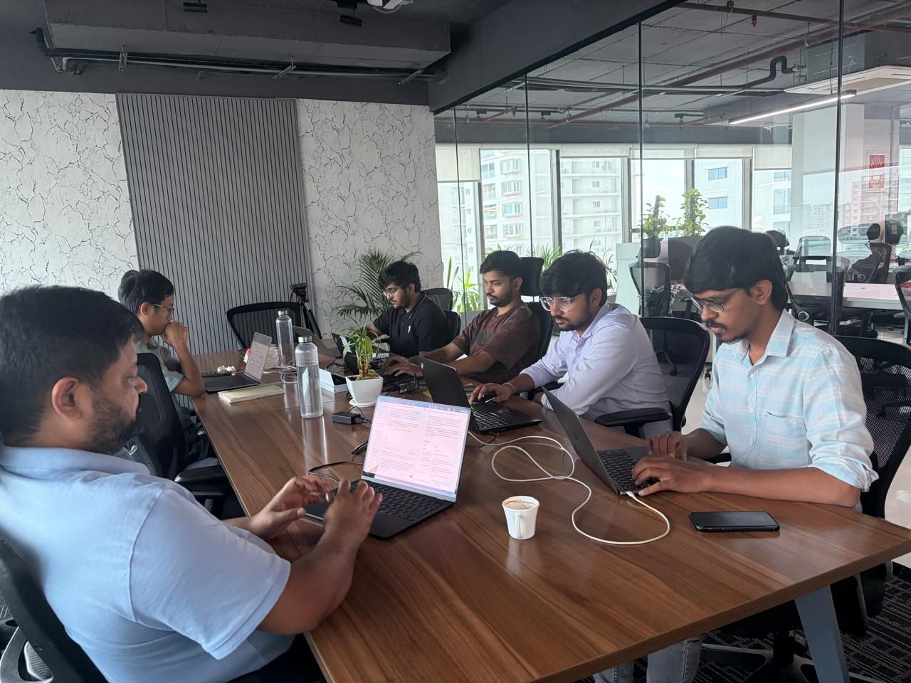 The Ethika team working with AI at the office